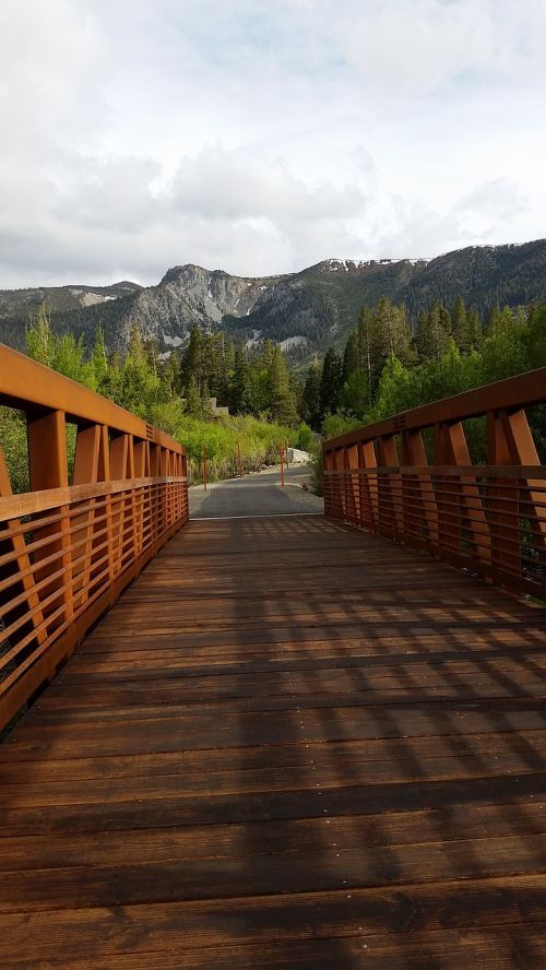 wooden bridge bridge mountains