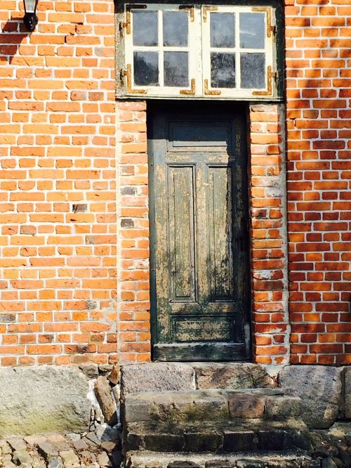 wooden door brick red