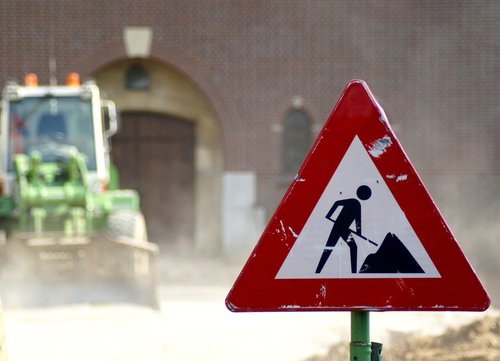 work  road sign  excavators