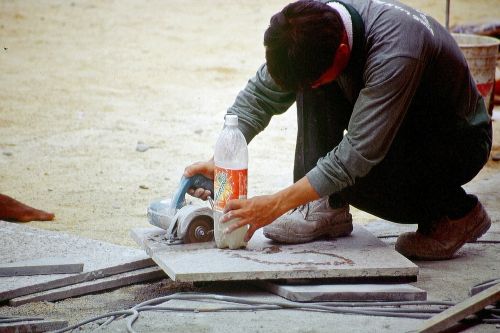 workers angle grinder saw