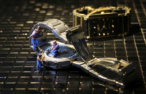 wrist watch  watchmaker  miniature figures