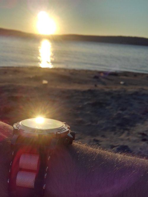 wristwatch  sea  sun