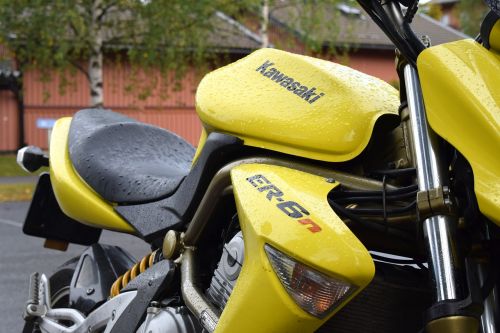 yellow motorcycle rain
