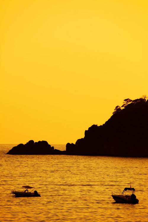 Yellow Sunset With Boats