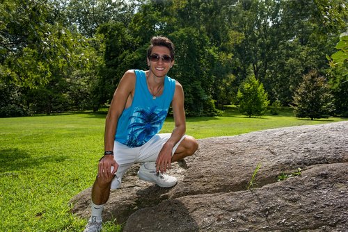 young man  boulder  smile