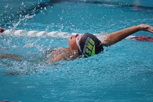 young swimmer backstroke swim meet