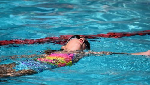 young swimmer backstroke swimming