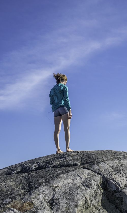 young woman windy rock