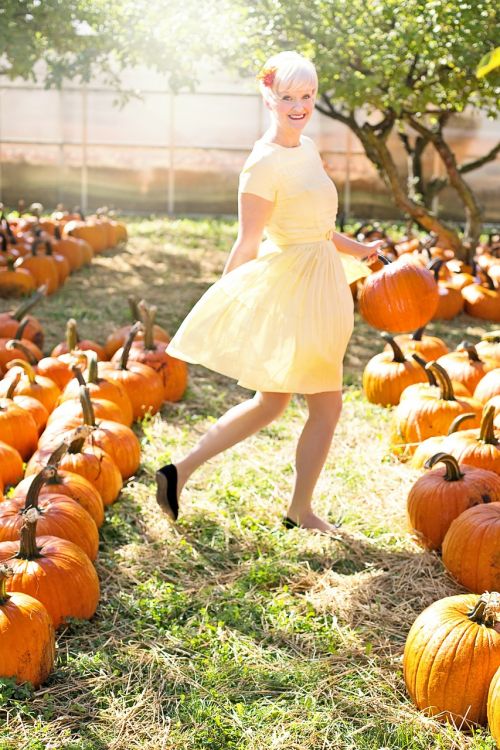 young woman beautiful pumpkins
