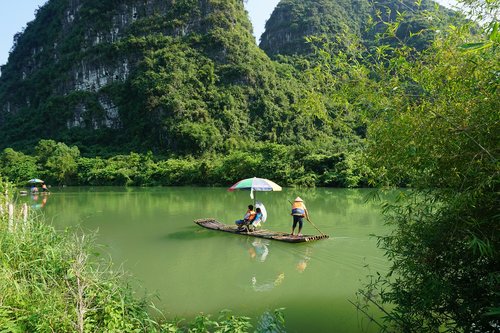 yulong river  boat  bamboo raft